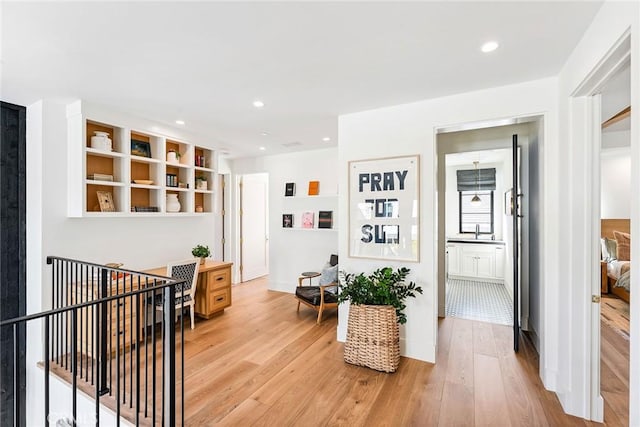 1831 Newport Hills Dr E, Newport Beach, CA 92660 - hallway with light wood-style floors and recessed lighting