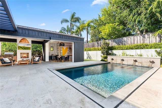 1831 Newport Hills Dr E, Newport Beach, CA 92660 - view of pool with a lit fireplace, a patio area, a fenced backyard, and area for grilling