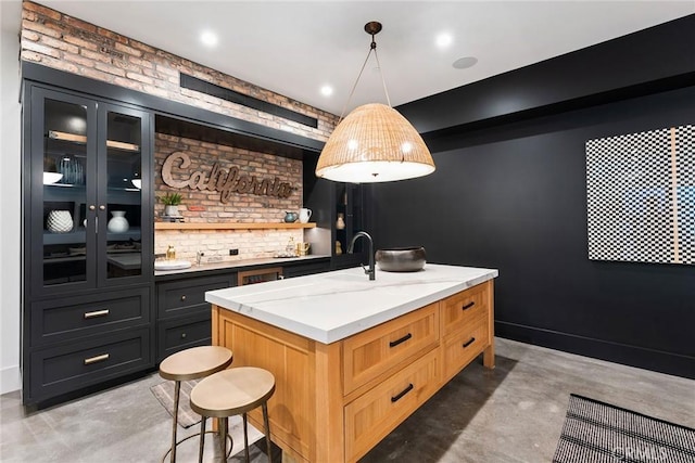 1831 Newport Hills Dr E, Newport Beach, CA 92660 - bar area featuring concrete flooring, pendant lighting, and brick wall