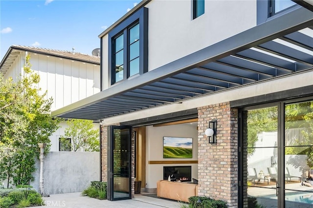 1831 Newport Hills Dr E, Newport Beach, CA 92660 - view of property exterior with board and batten siding, stucco siding, and brick siding