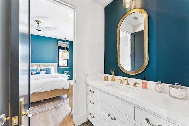 1831 Newport Hills Dr E, Newport Beach, CA 92660 - ensuite bathroom with vanity, wood finished floors, and ceiling fan