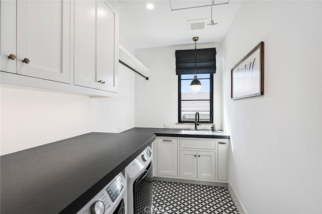 1831 Newport Hills Dr E, Newport Beach, CA 92660 - laundry area featuring washer / dryer, cabinet space, and light flooring