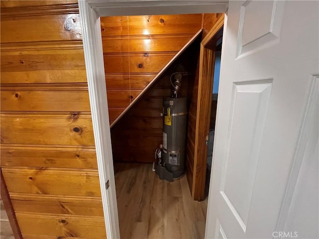 651 Community Dr, Lake Arrowhead, CA 92352 - hallway with strapped water heater and light wood-style flooring