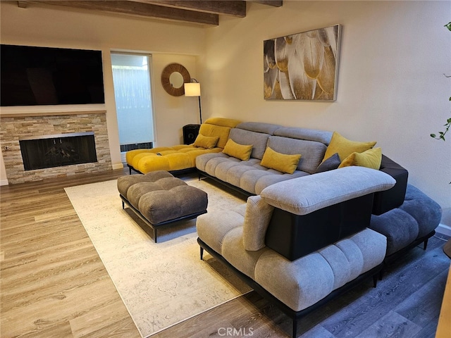 400 Monterey Rd Unit 10, Glendale, CA 91206 - living area featuring wood finished floors, beamed ceiling, and a fireplace