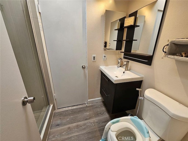 400 Monterey Rd Unit 10, Glendale, CA 91206 - bathroom with wood finished floors, a stall shower, and vanity