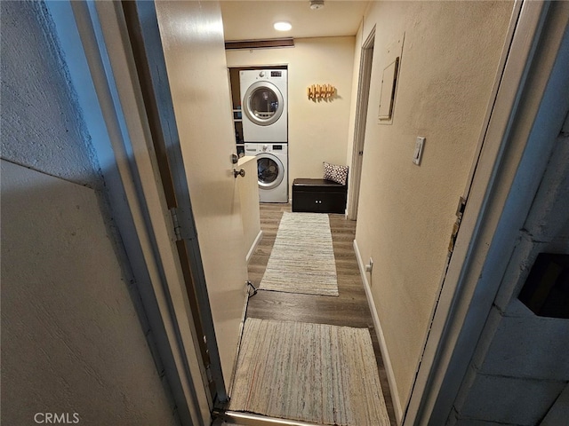 400 Monterey Rd Unit 10, Glendale, CA 91206 - laundry room featuring stacked washer / dryer, wood finished floors, and a textured wall