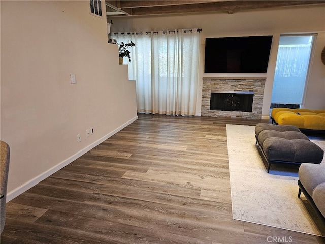 400 Monterey Rd Unit 10, Glendale, CA 91206 - living room featuring wood finished floors and a stone fireplace