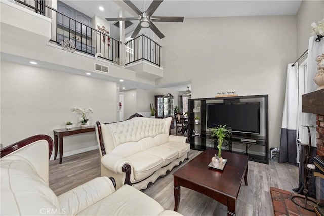 3108 Holbrook St, Bakersfield, CA 93312 - living room featuring a ceiling fan, wood finished floors, and a high ceiling