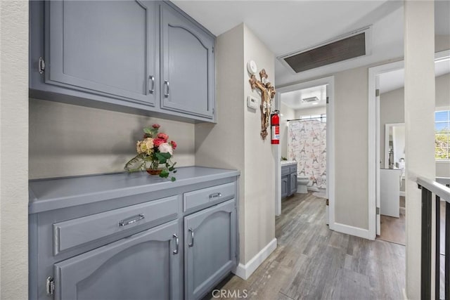3108 Holbrook St, Bakersfield, CA 93312 - hallway with light wood-type flooring and baseboards