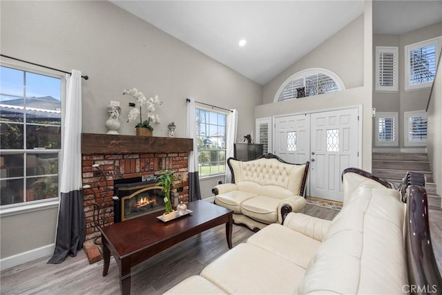3108 Holbrook St, Bakersfield, CA 93312 - living area with healthy amount of natural light, wood finished floors, high vaulted ceiling, and a fireplace