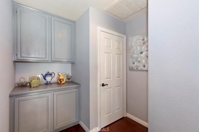 6939 Fremontia Ave, Fontana, CA 92336 - corridor featuring dark wood-type flooring and baseboards