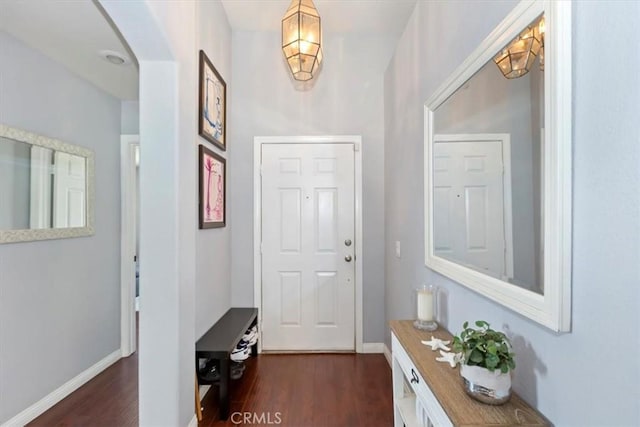 6939 Fremontia Ave, Fontana, CA 92336 - doorway to outside with dark wood finished floors and arched walkways
