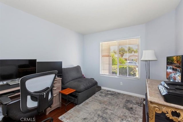 6939 Fremontia Ave, Fontana, CA 92336 - office area featuring baseboards and dark wood-type flooring