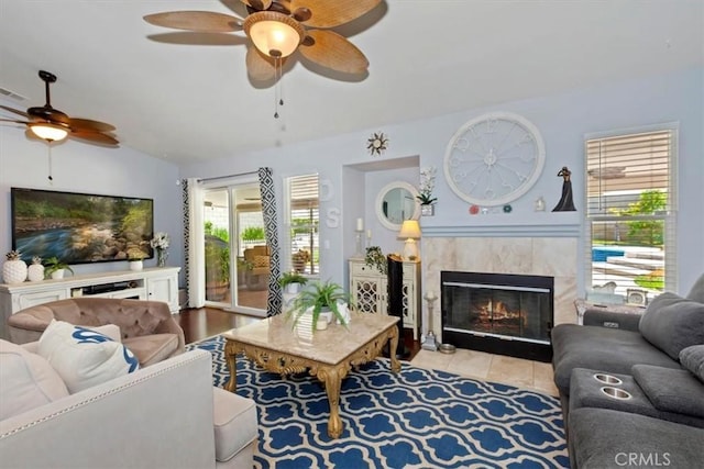 6939 Fremontia Ave, Fontana, CA 92336 - living area with a ceiling fan, lofted ceiling, and a fireplace