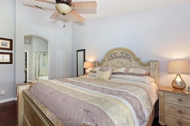 6939 Fremontia Ave, Fontana, CA 92336 - bedroom featuring arched walkways, dark wood-type flooring, and a ceiling fan