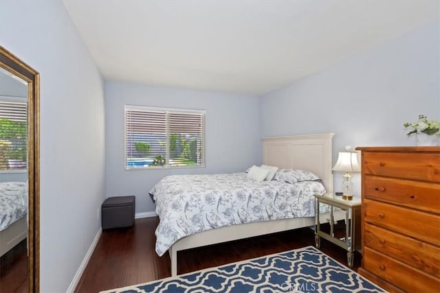 6939 Fremontia Ave, Fontana, CA 92336 - bedroom with multiple windows and dark wood-type flooring