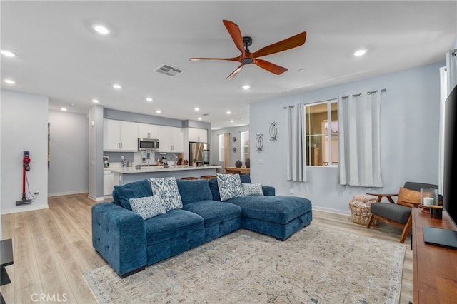 8234 Traveller St, Chino, CA 91710 - living area featuring ceiling fan, light wood-type flooring, and recessed lighting