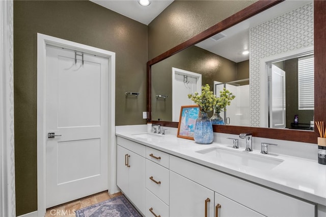 8234 Traveller St, Chino, CA 91710 - full bath with double vanity, a stall shower, and a textured wall