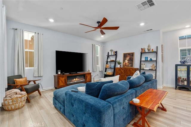 8234 Traveller St, Chino, CA 91710 - living area with light wood-style floors, a ceiling fan, plenty of natural light, and recessed lighting