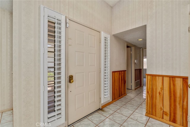 22533 Kinross Ln, Moreno Valley, CA 92557 - foyer entrance with wallpapered walls and light tile patterned floors