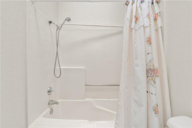 22533 Kinross Ln, Moreno Valley, CA 92557 - full bathroom featuring shower / bath combo and a textured wall