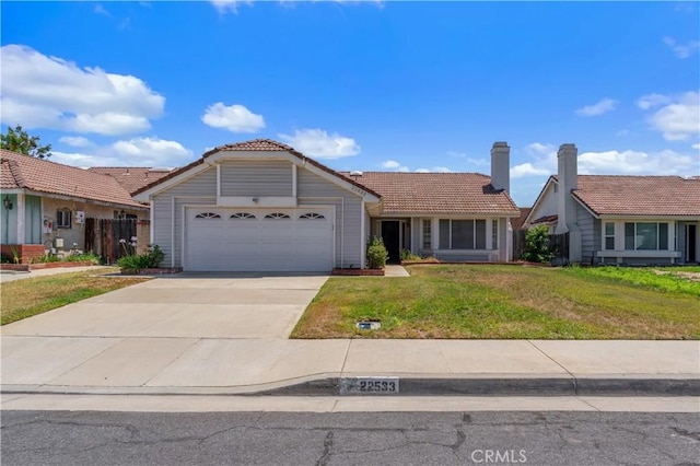 22533 Kinross Ln, Moreno Valley, CA 92557 - view of front of home featuring a tile roof, an attached garage, a front lawn, and concrete driveway