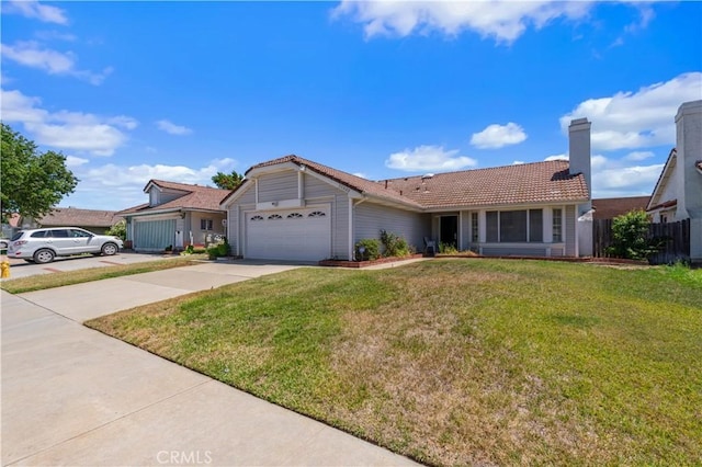 22533 Kinross Ln, Moreno Valley, CA 92557 - ranch-style house with a garage, driveway, a tile roof, and a chimney