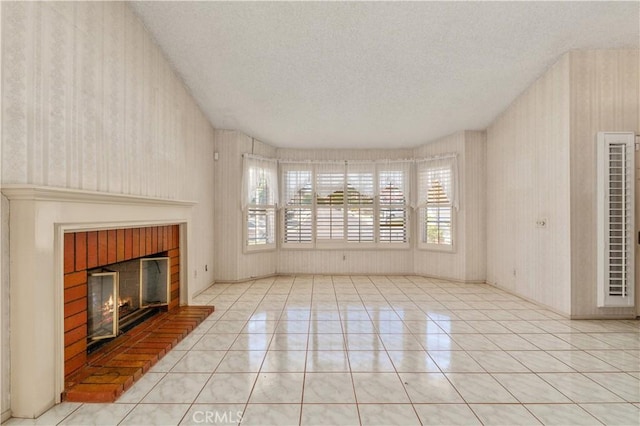 22533 Kinross Ln, Moreno Valley, CA 92557 - unfurnished living room featuring wallpapered walls, a textured ceiling, a fireplace, plenty of natural light, and a heating unit