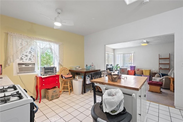 6186 Abronia Ave Unit 29, Palms, CA 92277 - dining space featuring a ceiling fan, light tile patterned floors, and cooling unit