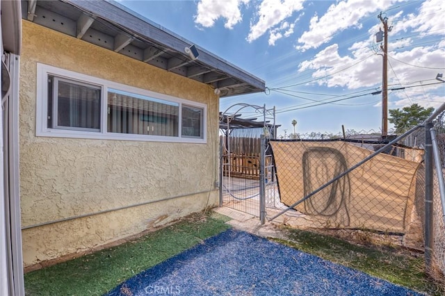 6186 Abronia Ave Unit 29, Palms, CA 92277 - view of side of home featuring stucco siding