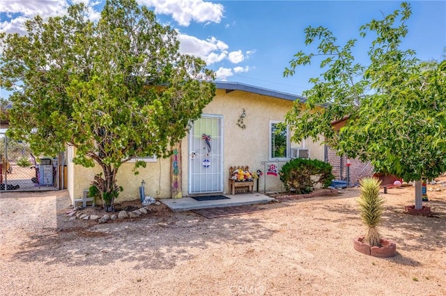 6186 Abronia Ave Unit 29, Palms, CA 92277 - view of front of property with stucco siding