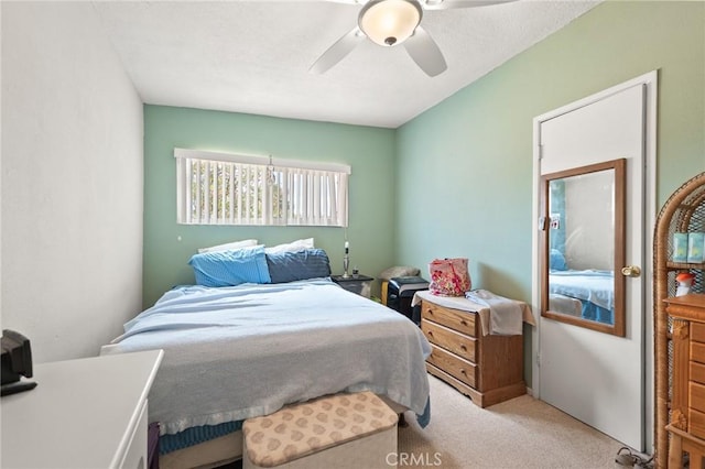 6186 Abronia Ave Unit 29, Palms, CA 92277 - bedroom with light carpet and ceiling fan