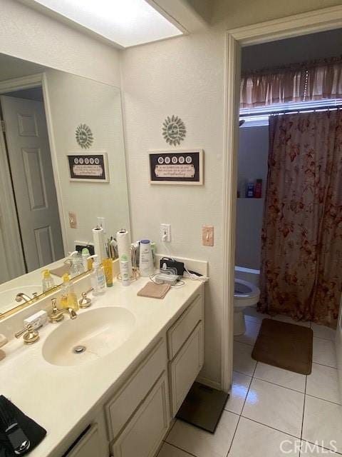 14310 Northstar Ave, Victorville, CA 92392 - full bathroom featuring vanity, tile patterned floors, and a shower with shower curtain