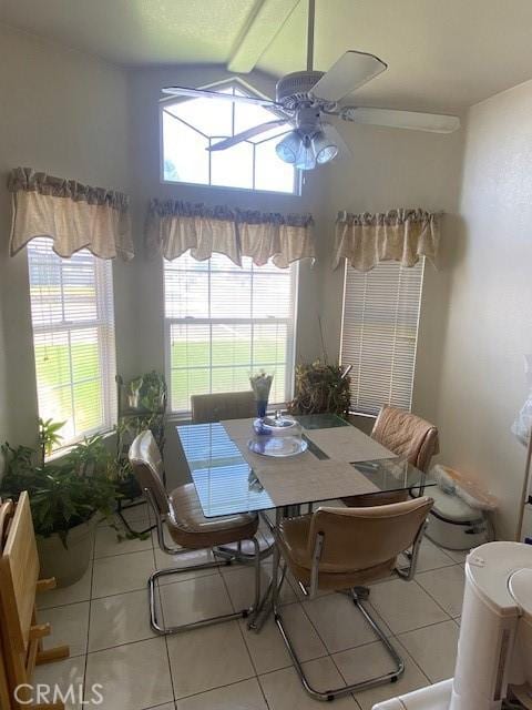 14310 Northstar Ave, Victorville, CA 92392 - dining room featuring a ceiling fan, tile patterned flooring, and vaulted ceiling