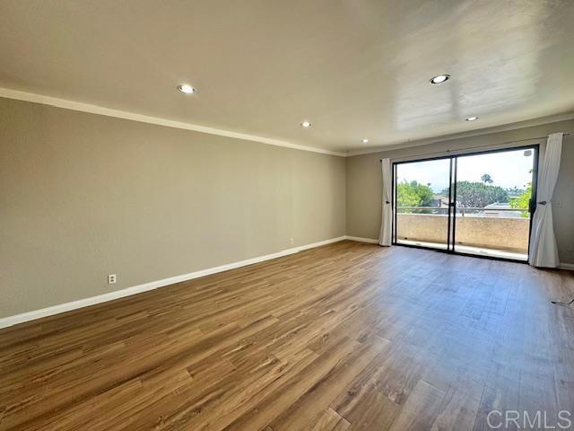 4545 Arizona St Unit 104, San Diego, CA 92116 - unfurnished room featuring crown molding, wood finished floors, and recessed lighting
