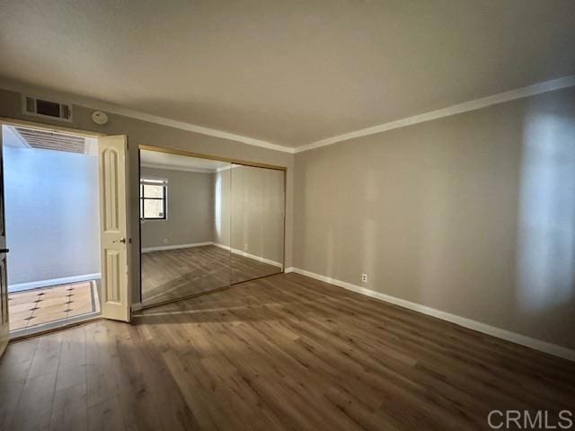 4545 Arizona St Unit 104, San Diego, CA 92116 - unfurnished room featuring ornamental molding, wood finished floors, and a smoke detector