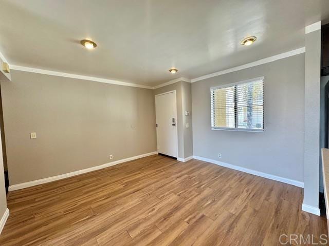 4545 Arizona St Unit 104, San Diego, CA 92116 - unfurnished room with ornamental molding and wood finished floors