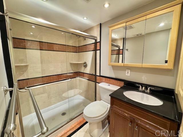 4545 Arizona St Unit 104, San Diego, CA 92116 - full bath featuring a stall shower, vanity, recessed lighting, and tile patterned flooring