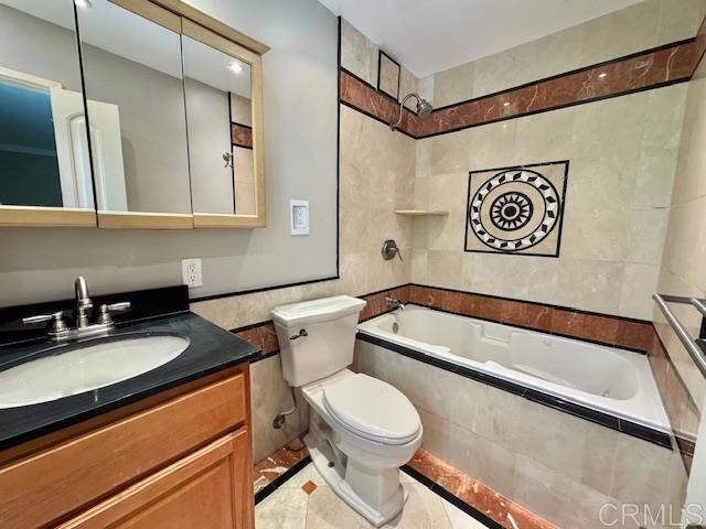 4545 Arizona St Unit 104, San Diego, CA 92116 - bathroom with tile walls, tiled shower / bath, and vanity