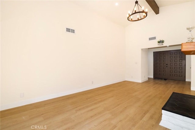 17532 Ludlow St, Granada Hills, CA 91344 - unfurnished living room featuring a chandelier, beamed ceiling, light wood finished floors, and high vaulted ceiling