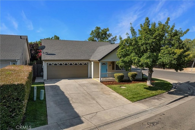 2081 Marilyn Dr, Chico, CA 95928 - ranch-style home featuring driveway, covered porch, an attached garage, a front lawn, and roof with shingles