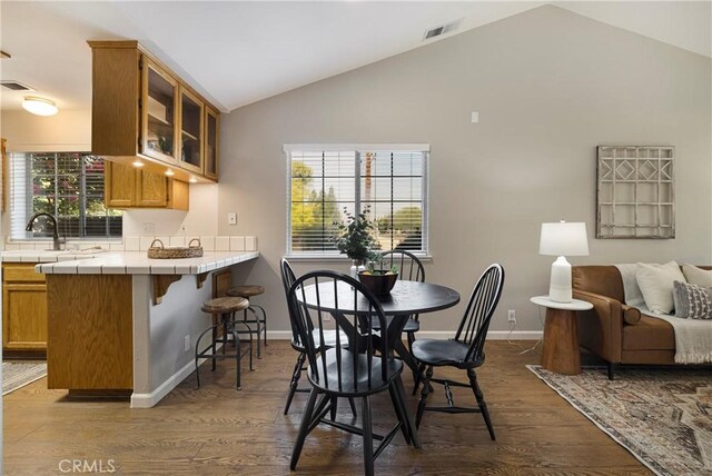2081 Marilyn Dr, Chico, CA 95928 - dining space with dark wood-type flooring and high vaulted ceiling