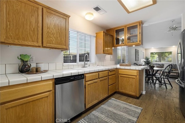 2081 Marilyn Dr, Chico, CA 95928 - kitchen featuring appliances with stainless steel finishes, dark wood-type flooring, a peninsula, glass insert cabinets, and open floor plan
