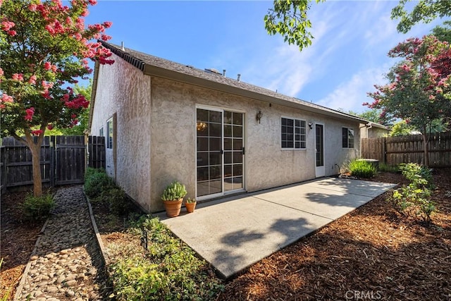 2081 Marilyn Dr, Chico, CA 95928 - back of house with stucco siding, a patio area, and a fenced backyard