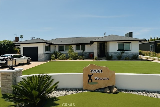 12861 Alamitos Way, Garden Grove, CA 92841 - view of front of house with stone siding, an attached garage, concrete driveway, stucco siding, and a front lawn