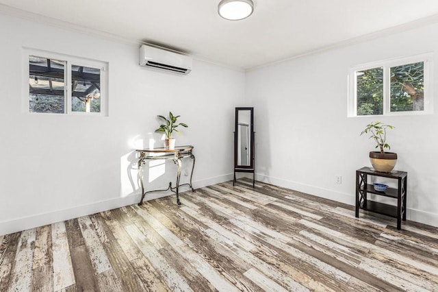 1670 Alta Vista Dr, Vista, CA 92084 - spare room featuring an AC wall unit, crown molding, and wood finished floors