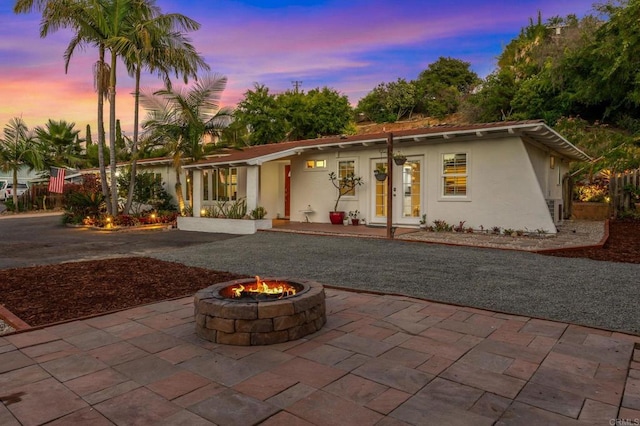 1670 Alta Vista Dr, Vista, CA 92084 - ranch-style home featuring a fire pit, a patio area, french doors, and stucco siding