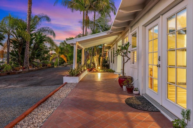 1670 Alta Vista Dr, Vista, CA 92084 - patio terrace at dusk with french doors and a patio area