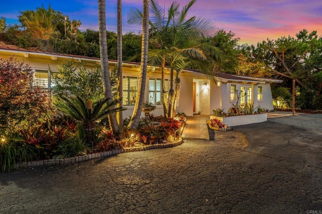 1670 Alta Vista Dr, Vista, CA 92084 - view of front facade with stucco siding and french doors