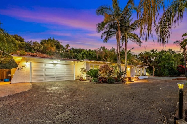 1670 Alta Vista Dr, Vista, CA 92084 - view of front facade with stucco siding, driveway, and an attached garage